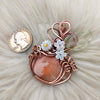 Peach Scolecite Pumpkin Pendant In Copper