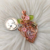 Potion Bottle Pendant With Butterfly Accents