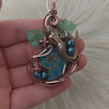 Mermaid And Glass Ammonite Pendant In Copper